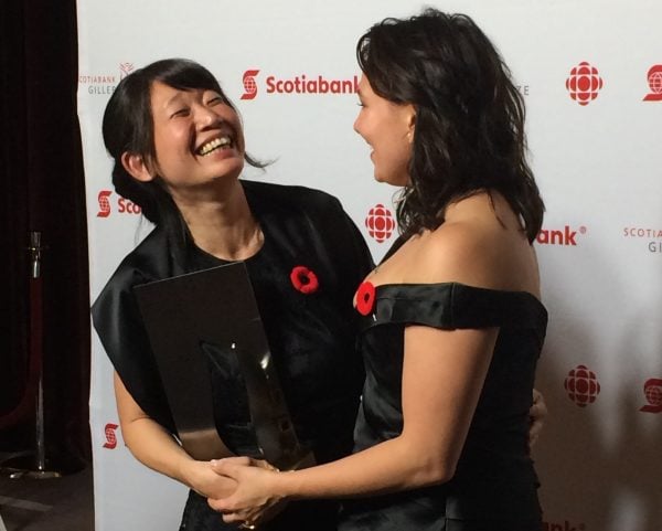 Madeleine Thien shakes hands with Tanya Tagaq