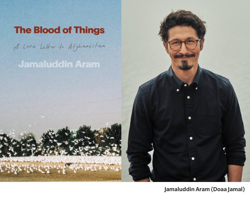 The cover of The Blood of Things: A Love Letter to Afghanistan by Jamaluddin Aram, showing a flock of white birds across a field beneath a pale blue sky, sits beside a portrait of Aram, a smiling man with dark hair, glasses, and a black button-up shirt. The caption identifies him as Jamaluddin Aram.