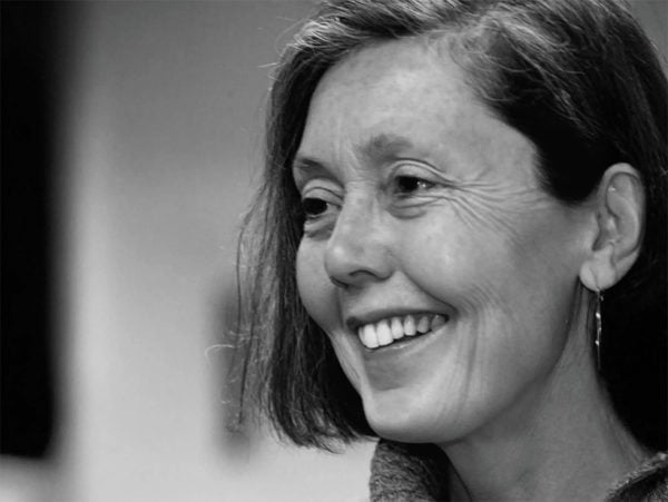 Black and white hoto of a smiling whote woman with bob-length hair